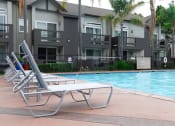 Thumbnail 12 of 42 - Poolside Lounging at Canyon Club Apartments