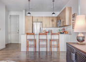 Thumbnail 3 of 6 - The Foundry Kitchen Island with Barstools at The Foundry Apartments & Townhomes, Billings, 84601