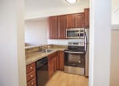 Thumbnail 8 of 25 - Modern Kitchen at Revo 225 Apartments, Renton, 98057