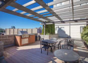Thumbnail 38 of 40 - Picnic Area with Grilling Stations at Metropolitan Collection Apartments, Renton, 98057
