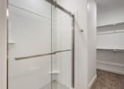 Thumbnail 23 of 28 - Shower with Glass Sliding Door at Amara Apartments,Midvale,UT,84047