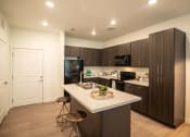 Thumbnail 4 of 38 - Island Kitchen at Garden Lofts Apartments, Salt Lake City, 84101