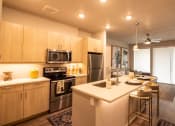 Thumbnail 11 of 44 - Fully Equipped Kitchen With Modern Appliances at Soleil Lofts Apartments, Herriman, UT