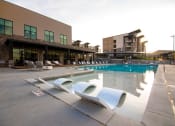 Thumbnail 31 of 44 - Pool Side Lounge Area With Sundeck at Soleil Lofts Apartments, Utah, 84096