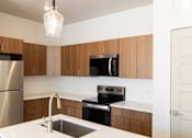Thumbnail 45 of 52 - Spacious Kitchen with Island at The Ash Apartments & Townhomes