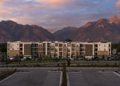 Thumbnail 40 of 41 - View of Parc View Apartments & Townhomes During Sunset Among the Mountains