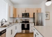 Thumbnail 4 of 37 - Gourmet Kitchen with Modern Appliances at The Hudson Townhomes Salt Lake City UT 84106