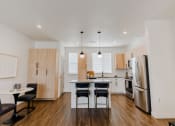 Thumbnail 6 of 37 - Open Concept Kitchen & Dining Area at The Hudson Townhomes Salt Lake City UT