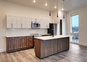 Thumbnail 41 of 53 - The Stack - Sugarhouse Apartments Kitchen with White and Brown Cabinets