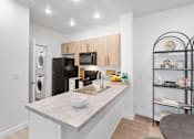 Thumbnail 8 of 16 - The Veridian Kitchen with Access to Washer and Dryer