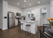 Thumbnail 8 of 41 - Two Bedroom Townhome Kitchen with Island at Parc View Apartments and Townhomes Midvale, UT 84047