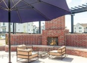 Thumbnail 36 of 39 - Outdoor courtyard with fire pit at Rivulet Apartments, American Fork, UT