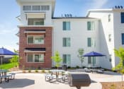 Thumbnail 37 of 39 - Outdoor Grill with Picnic Area at Rivulet Apartments, American Fork, 84003