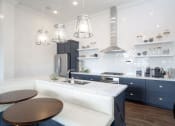 Thumbnail 26 of 39 - Resident Lounge with Island Kitchen With Island Dining at Rivulet Apartments, Utah