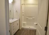 Thumbnail 6 of 16 - Main Bath with Walk-in Shower at Kimpton Square Senior Apartments