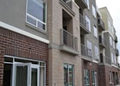 Thumbnail 9 of 16 - Exterior photo with balconies at Kimpton Square Senior Apartments, Midvale, UT