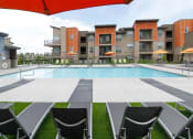 Thumbnail 38 of 40 - Swimming Pool With Lounge Chairs at Lofts at 7800 Apartments, Midvale, UT, 84047