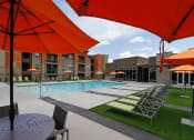 Thumbnail 39 of 40 - Swimming Pool Area With Shaded Chairs at Lofts at 7800 Apartments, Midvale, UT