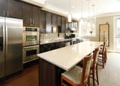 Thumbnail 17 of 25 - Community Kitchen at Tuscany Villas Senior Apartments, Midvale, UT, 84047