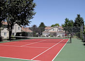 Thumbnail 19 of 26 - Tennis court  at Devonshire Court Apartments & Townhomes, North Logan