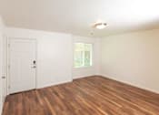 Thumbnail 18 of 26 - Woodgrain Floor Living Room at Devonshire Court Apartments & Townhomes, North Logan, Utah