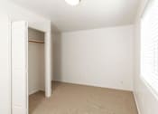 Thumbnail 17 of 26 - Bedroom with Closet at Devonshire Court Apartments & Townhomes, North Logan, 84341