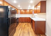 Thumbnail 9 of 26 - Fully Furnished Kitchen at Devonshire Court Apartments & Townhomes, North Logan, Utah