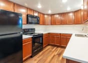 Thumbnail 3 of 26 - Fully Equipped Kitchen at Devonshire Court Apartments & Townhomes, North Logan, 84341