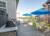 Thumbnail 36 of 38 - Barbecue And Grilling Station with sitting space at Parc on Center Apartments & Townhomes, Orem, Utah