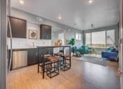 Thumbnail 4 of 36 - Living Room With Kitchen View at Element 31 Apartments, Utah
