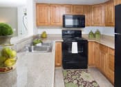 Thumbnail 4 of 26 - Modern Kitchen With Custom Cabinet at Promontory Point Apartments, Sandy, UT, 84094