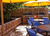 Thumbnail 35 of 38 - Poolside Dining Tables at San Marino Apartments, South Jordan, Utah