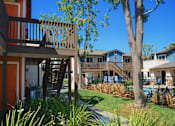 Thumbnail 6 of 12 - Walkway by pool at Village Grove