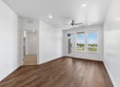 Thumbnail 20 of 37 - The Grove at Orchard Park Living Room and Door to Bedroom