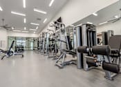 Thumbnail 30 of 48 - Workout Machines at The Arza Apartments