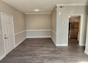 Thumbnail 7 of 10 - A room with a white door and a grey floor. The Cloisters Apartments, 902 67th Avenue North, Myrtle Beach, SC