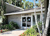 Thumbnail 5 of 5 - The front of a building with the number 3975 and the words Orchard Glen Apartments on it.