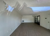 Thumbnail 13 of 44 - community room with white walls and wood floors
