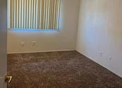 Thumbnail 5 of 7 - an empty room with a window and a carpet