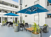 Thumbnail 32 of 38 - patio and umbrellas at Harbor Terrace Apartments, San Pedro