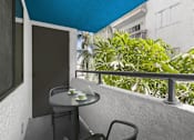 Thumbnail 19 of 38 - a balcony or terrace with a table and chairs at Harbor Terrace Apartments, San Pedro , CA