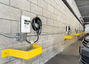 Thumbnail 9 of 38 - an electric car charging station on the wall of a parking garage at Harbor Terrace Apartments, San Pedro
