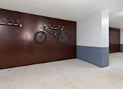 Thumbnail 14 of 21 - a bike hanging on a wall in a room