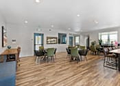 Thumbnail 10 of 21 - a large living room with tables and chairs