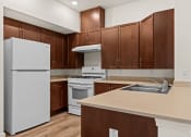 Thumbnail 7 of 12 - a kitchen with white appliances and wooden cabinets
