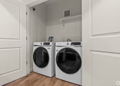 Thumbnail 8 of 12 - the laundry room in a home with two washing machines