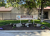 Thumbnail 1 of 7 - a sign in front of a building