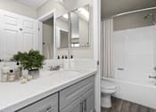 Thumbnail 17 of 38 - a bathroom with a sink and a shower and a toilet at Harbor Terrace Apartments, California
