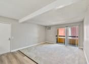 Thumbnail 12 of 30 - the spacious living room with sliding glass doors to the balcony at Brookhollow Apartments, California, 91792