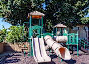 Thumbnail 9 of 16 - a playground with two slides and a tube